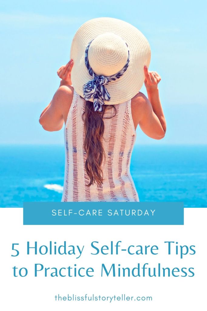 a woman standing beside the beach and watching the sea as her holiday self-care act